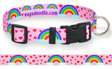 A pink dog collar with rainbows arching between clouds and red hearts floating all around.
